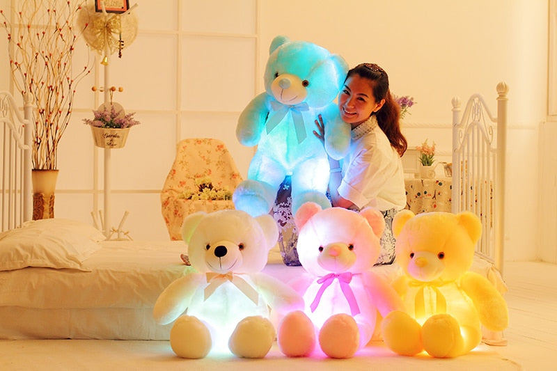 a girl poses with light up LED teddy bears