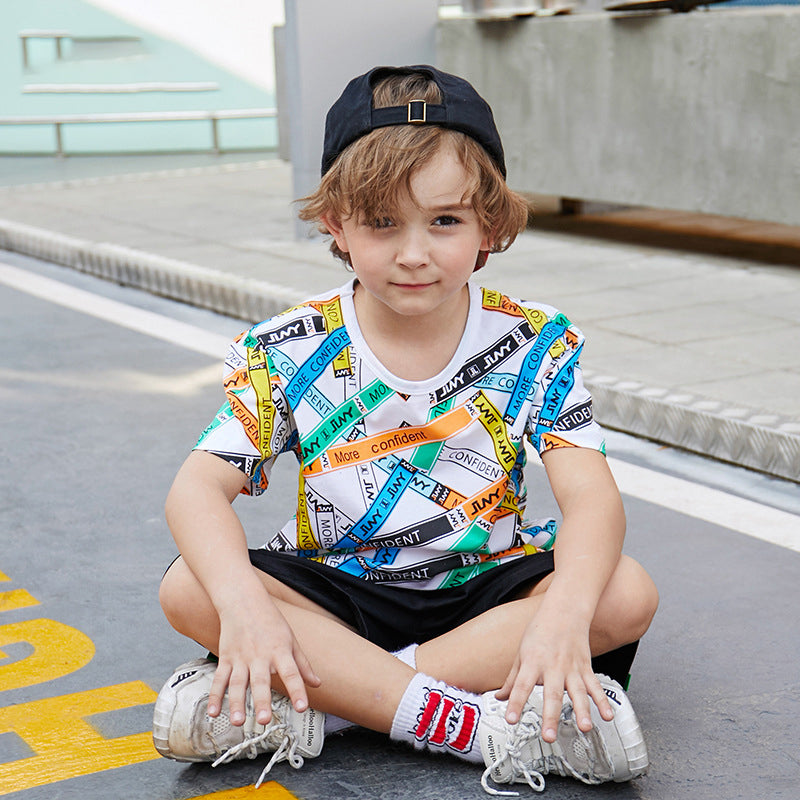 a child poses with the printed T-shirt on sale on Kiddle Kart 