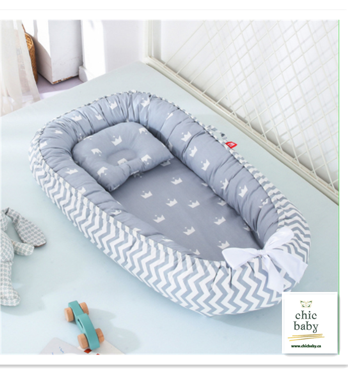 a removable and washable bed crib for children with grey background and crown tessellation   