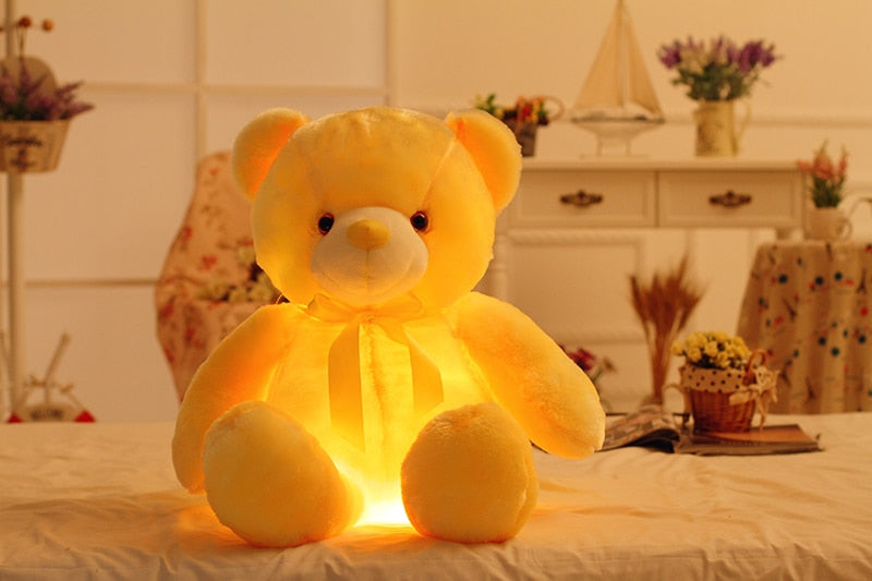 golden yellow colored light up teddy bear