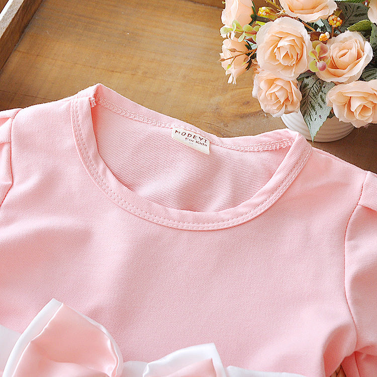 the top front part of the pink long sleeve dress