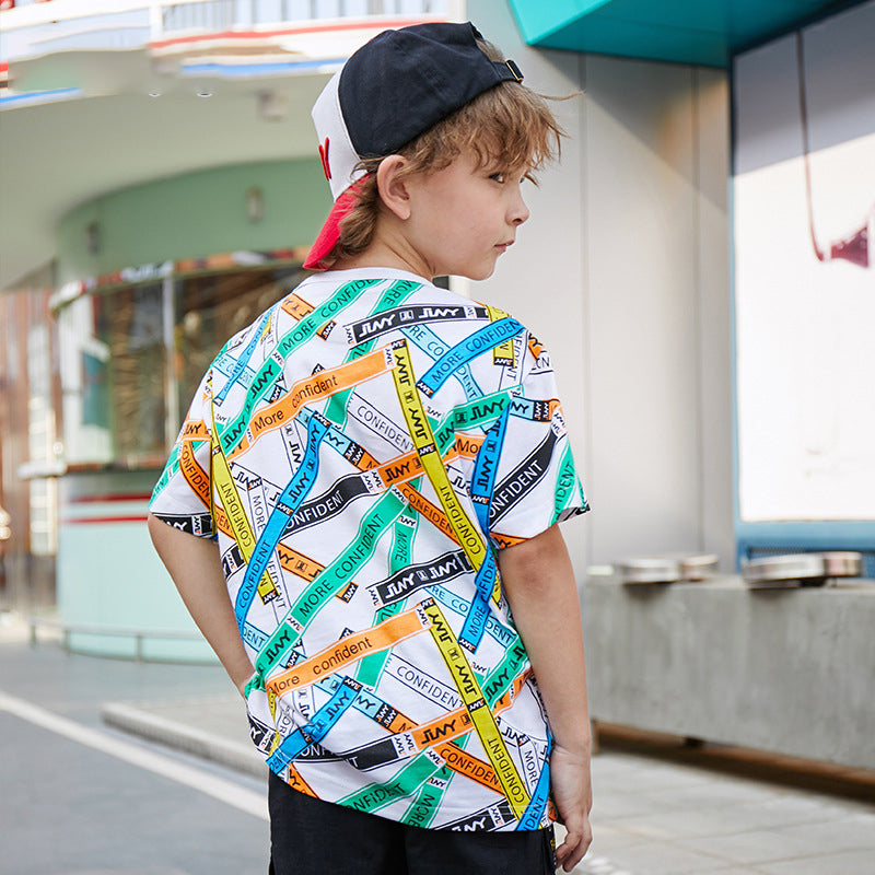 a child poses with the printed T-shirt on sale on Kiddle Kart 