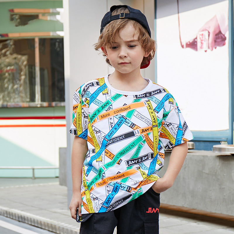 a child poses with the printed T-shirt on sale on Kiddle Kart 